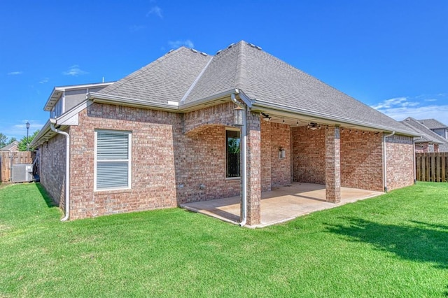 3024 Wakefield Rd, Edmond, OK 73034 - rear view of property featuring a patio, brick siding, roof with shingles, and a ceiling fan