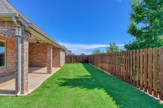 3024 Wakefield Rd, Edmond, OK 73034 - fenced backyard featuring a patio and ceiling fan