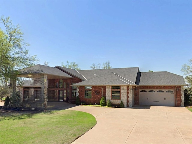 1608 Bentwater Dr, Kingfisher, OK 73750 - view of front of property with driveway, a garage, a front lawn, a shingled roof, and brick siding