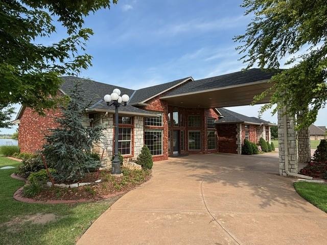 1608 Bentwater Dr, Kingfisher, OK 73750 - view of front facade with stone siding