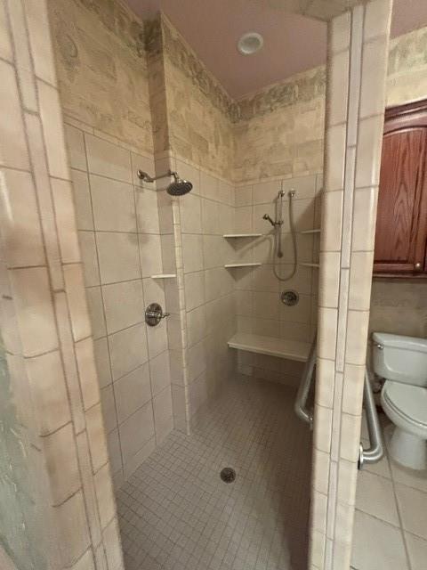 1608 Bentwater Dr, Kingfisher, OK 73750 - full bath featuring a stall shower, tile patterned floors, and tile walls