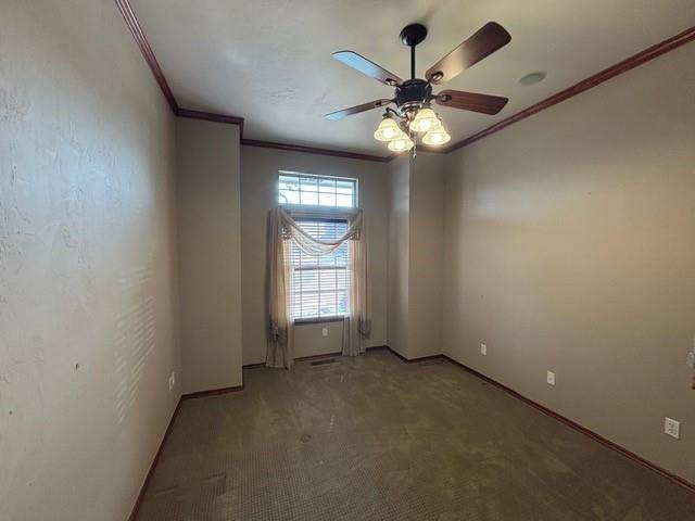 1608 Bentwater Dr, Kingfisher, OK 73750 - empty room with crown molding, a ceiling fan, and light carpet