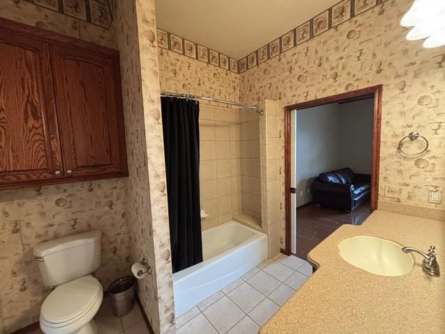 1608 Bentwater Dr, Kingfisher, OK 73750 - bathroom featuring tile patterned floors, shower / tub combo, and vanity