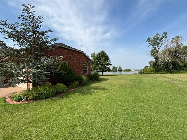 1608 Bentwater Dr, Kingfisher, OK 73750 - view of green lawn with a water view