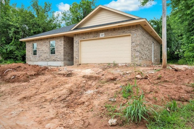 2807 N Lyon Dr, Oklahoma City, OK 73107 - view of front of property with brick siding and a garage