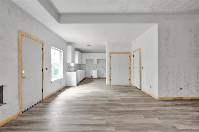 2807 N Lyon Dr, Oklahoma City, OK 73107 - unfurnished living room featuring light wood-style flooring and baseboards
