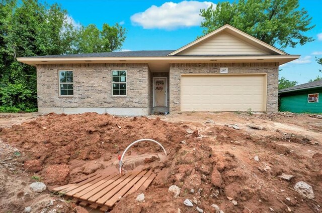 2807 N Lyon Dr, Oklahoma City, OK 73107 - ranch-style house with brick siding and a garage