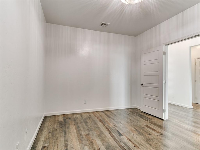 8525 Maple Creek Rd, Arcadia, OK 73007 - spare room featuring wood finished floors and baseboards