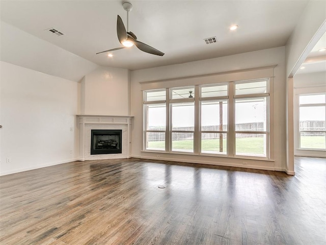 8525 Maple Creek Rd, Arcadia, OK 73007 - unfurnished living room featuring ceiling fan, wood finished floors, a fireplace, baseboards, and vaulted ceiling