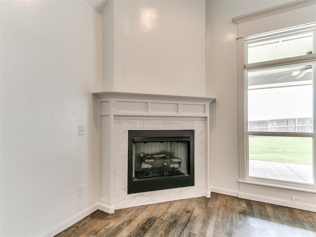 8525 Maple Creek Rd, Arcadia, OK 73007 - detailed view of wood finished floors, baseboards, and a fireplace