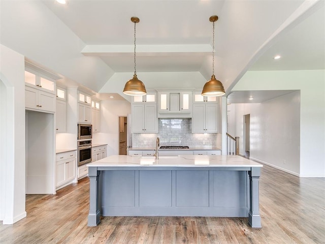8525 Maple Creek Rd, Arcadia, OK 73007 - kitchen featuring stainless steel appliances, backsplash, light countertops, vaulted ceiling, and white cabinets