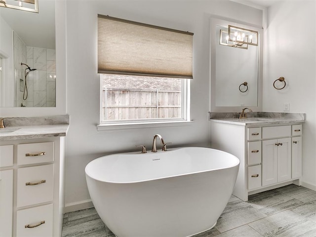 8525 Maple Creek Rd, Arcadia, OK 73007 - bathroom featuring a freestanding bath, vanity, and baseboards