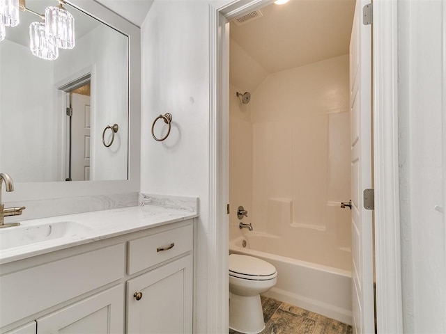 8525 Maple Creek Rd, Arcadia, OK 73007 - full bathroom with vanity, toilet,  shower combination, and wood finished floors