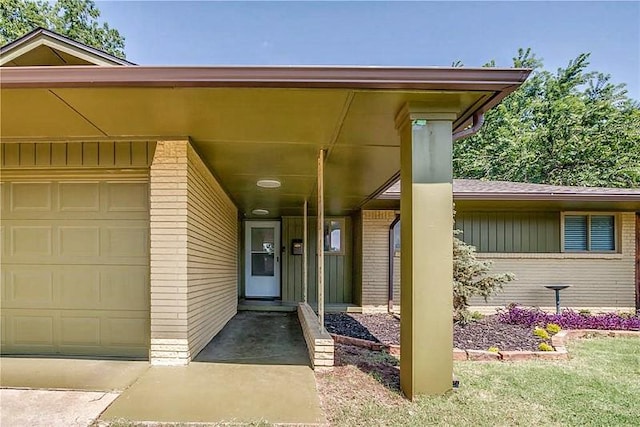 5704 N Warren Ave, Oklahoma City, OK 73112 - property entrance with a garage and brick siding