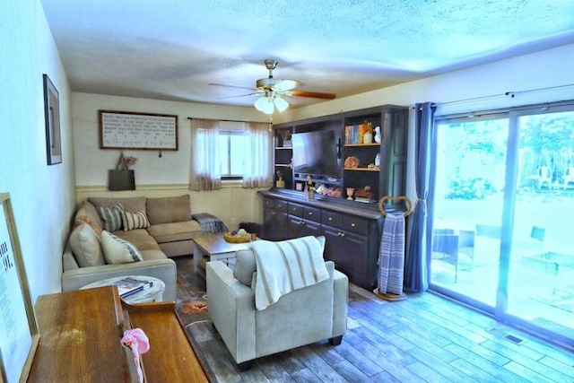 5704 N Warren Ave, Oklahoma City, OK 73112 - living area with ceiling fan and wood finished floors