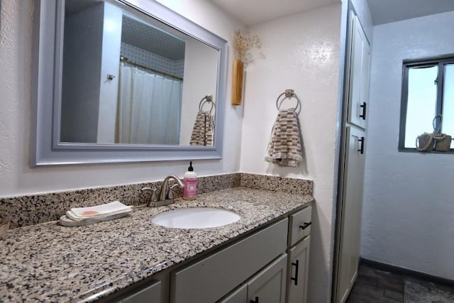 5704 N Warren Ave, Oklahoma City, OK 73112 - full bathroom featuring vanity and baseboards