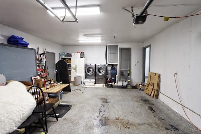 5704 N Warren Ave, Oklahoma City, OK 73112 - garage featuring a garage door opener and washer and clothes dryer