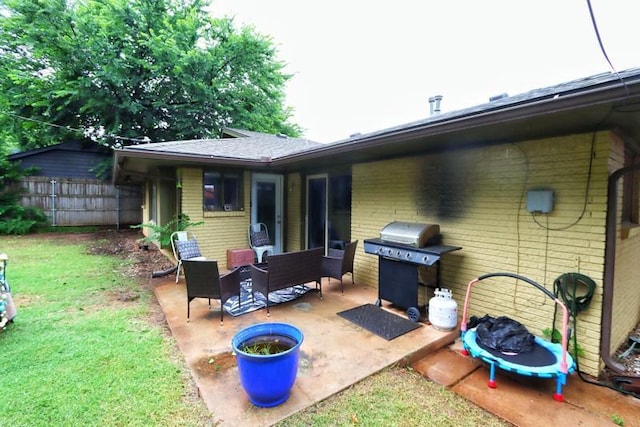 5704 N Warren Ave, Oklahoma City, OK 73112 - rear view of house with a patio area and brick siding