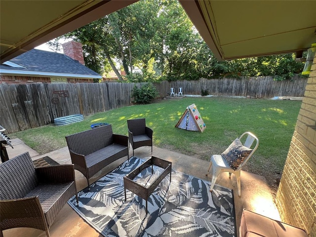 5704 N Warren Ave, Oklahoma City, OK 73112 - fenced backyard featuring a patio area and outdoor lounge area
