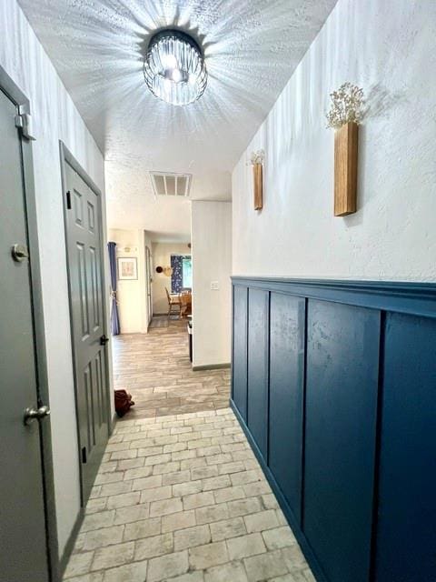 5704 N Warren Ave, Oklahoma City, OK 73112 - hallway featuring brick flooring