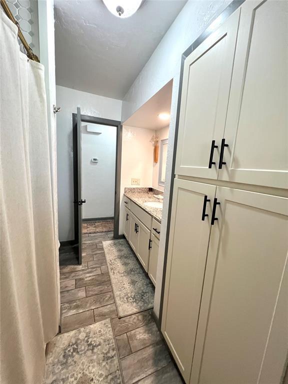 5704 N Warren Ave, Oklahoma City, OK 73112 - bathroom featuring vanity