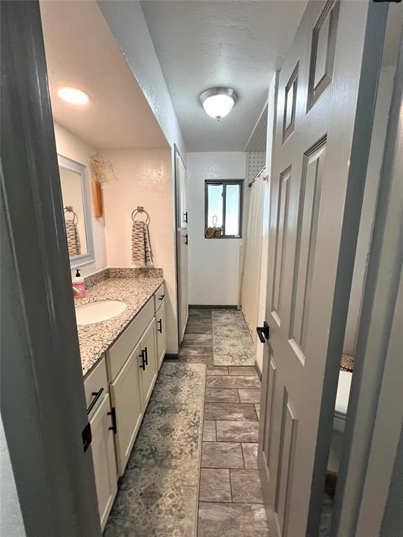 5704 N Warren Ave, Oklahoma City, OK 73112 - full bath featuring vanity and a shower with curtain