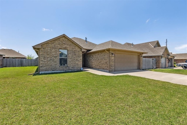 1012 SW 13th St, Moore, OK 73160 - view of front of home with an attached garage, brick siding, driveway, and a shingled roof