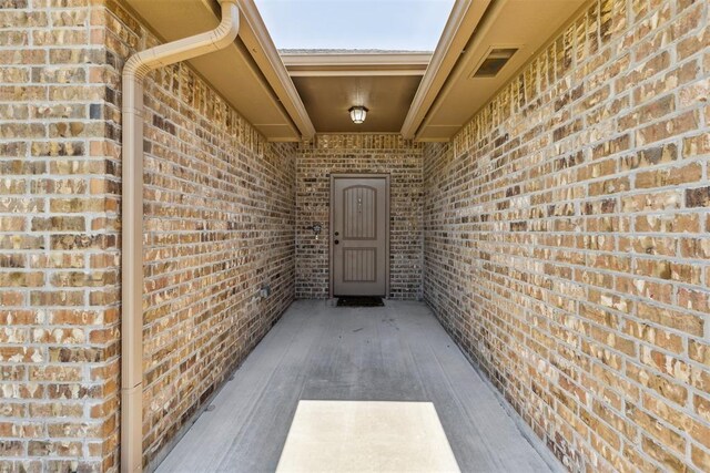 1012 SW 13th St, Moore, OK 73160 - property entrance featuring brick siding