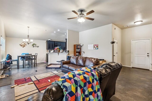 1012 SW 13th St, Moore, OK 73160 - living room with concrete flooring, a chandelier, a ceiling fan, baseboards, and lofted ceiling