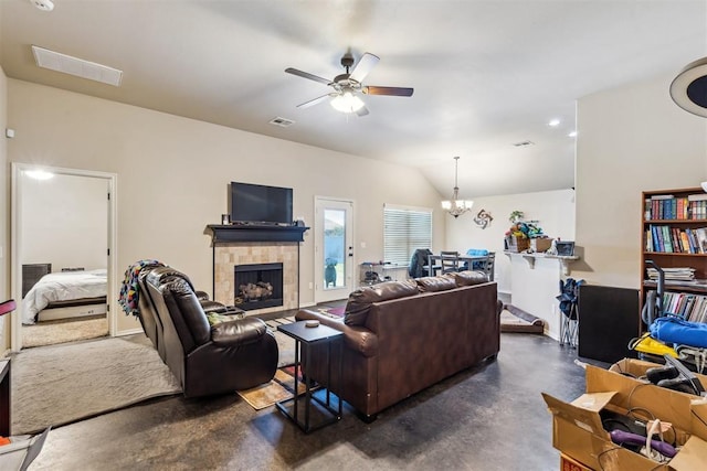1012 SW 13th St, Moore, OK 73160 - living area with ceiling fan, concrete flooring, a fireplace, a chandelier, and vaulted ceiling