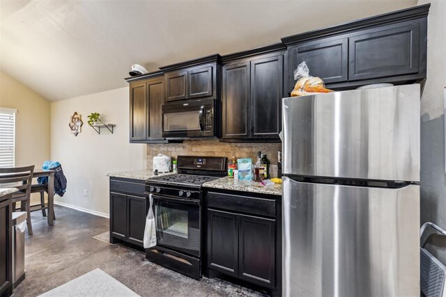 1012 SW 13th St, Moore, OK 73160 - kitchen with black appliances, tasteful backsplash, lofted ceiling, baseboards, and concrete floors