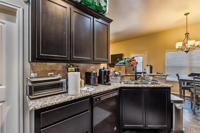1012 SW 13th St, Moore, OK 73160 - kitchen with black dishwasher, a sink, a chandelier, a peninsula, and tasteful backsplash