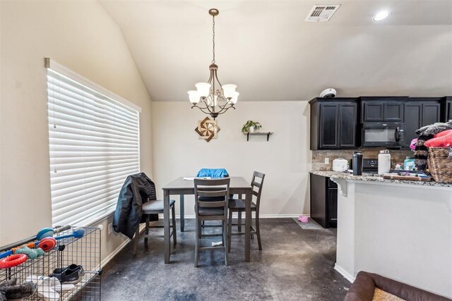 1012 SW 13th St, Moore, OK 73160 - dining area with a chandelier, lofted ceiling, and baseboards