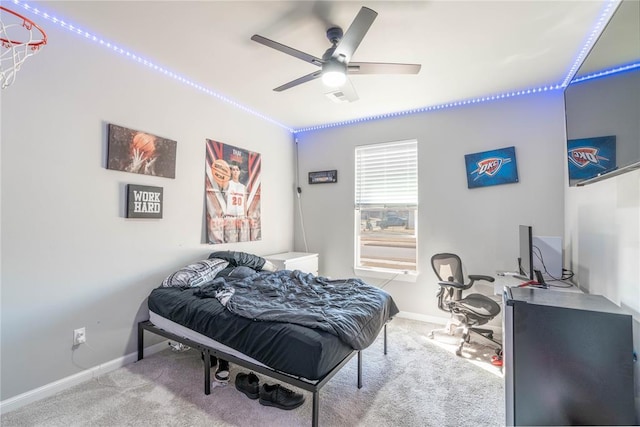 5808 Ledgestone Dr, Mustang, OK 73064 - carpeted bedroom featuring baseboards and a ceiling fan