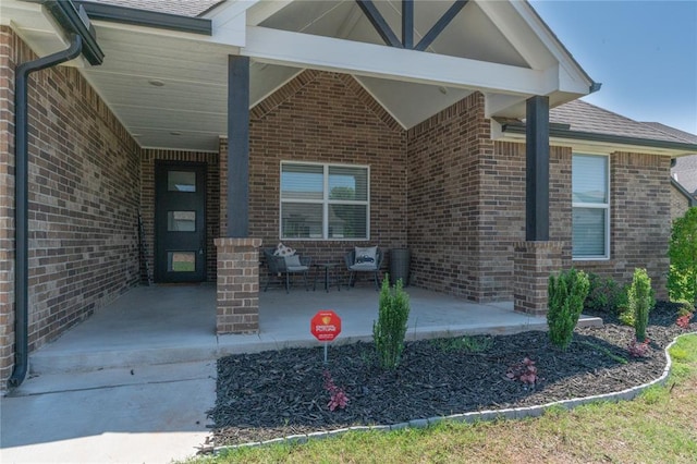 5808 Ledgestone Dr, Mustang, OK 73064 - doorway to property with brick siding and an attached carport