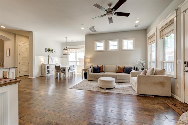 1508 Station St, Edmond, OK 73034 - living area featuring healthy amount of natural light, dark wood finished floors, a ceiling fan, and recessed lighting