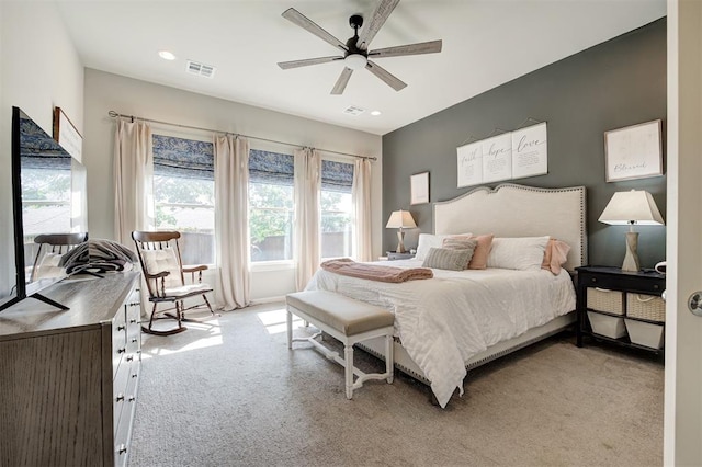 1508 Station St, Edmond, OK 73034 - bedroom featuring light carpet, multiple windows, ceiling fan, and recessed lighting