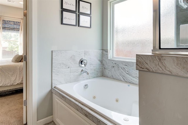 1508 Station St, Edmond, OK 73034 - ensuite bathroom with plenty of natural light and a whirlpool tub