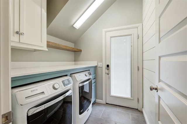 1508 Station St, Edmond, OK 73034 - laundry room featuring washing machine and clothes dryer, cabinet space, and light tile patterned floors