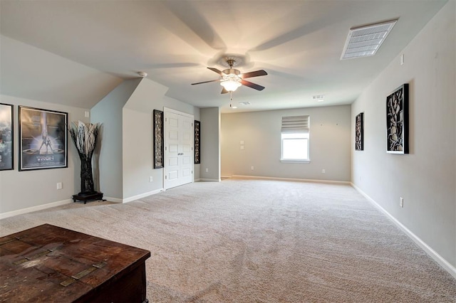 1508 Station St, Edmond, OK 73034 - unfurnished living room with light colored carpet and a ceiling fan