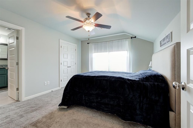 1508 Station St, Edmond, OK 73034 - bedroom featuring lofted ceiling, light carpet, a ceiling fan, and connected bathroom