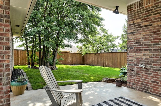 1508 Station St, Edmond, OK 73034 - fenced backyard with a patio