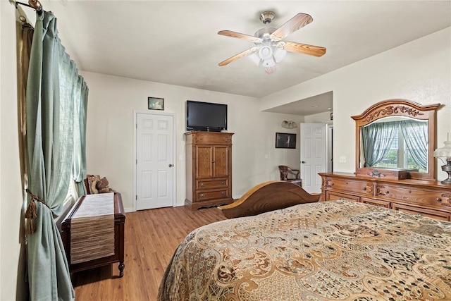 16350 SW 15th St, Yukon, OK 73099 - bedroom featuring light wood-style floors, ceiling fan, and baseboards