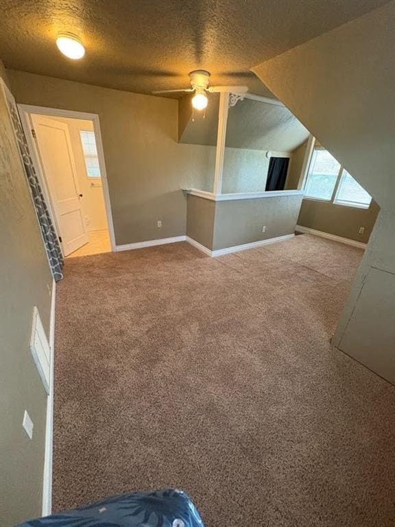 408 N Findlay St, Norman, OK 73071 - bonus room with carpet, a textured ceiling, a ceiling fan, and baseboards
