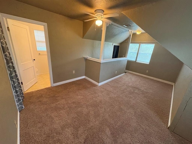 408 N Findlay St, Norman, OK 73071 - carpeted empty room featuring ceiling fan, a textured ceiling, baseboards, and lofted ceiling
