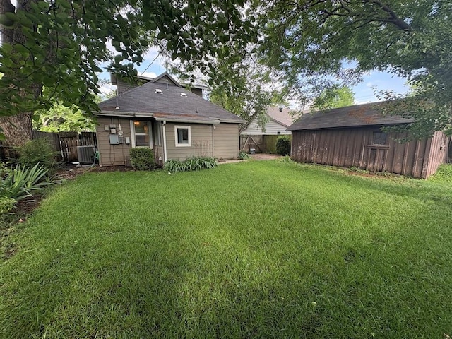 408 N Findlay St, Norman, OK 73071 - view of yard featuring central air condition unit and an outbuilding