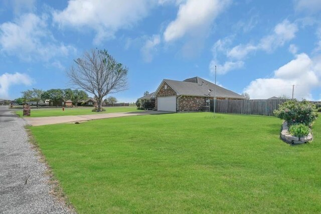 2 NW Havenshire Cir, Lawton, OK 73505 - view of yard featuring driveway and an attached garage