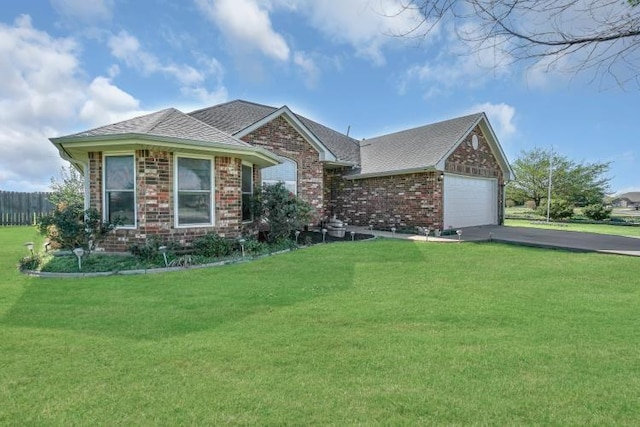 2 NW Havenshire Cir, Lawton, OK 73505 - ranch-style home featuring driveway, an attached garage, brick siding, and a shingled roof