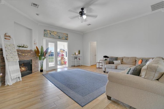 2 NW Havenshire Cir, Lawton, OK 73505 - living area with ornamental molding, ceiling fan, light wood finished floors, and a stone fireplace