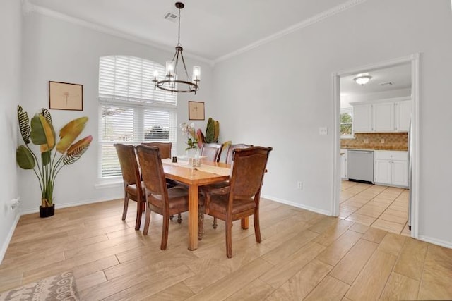 2 NW Havenshire Cir, Lawton, OK 73505 - dining space with a chandelier, ornamental molding, light wood-style floors, and baseboards